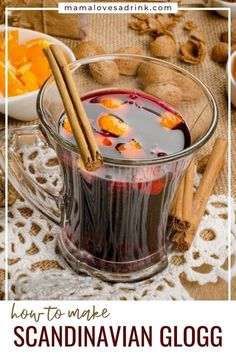 a glass mug filled with liquid and cinnamons on top of a lace doily