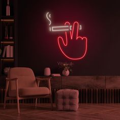 a living room with a neon sign on the wall and a chair next to it