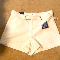 White Belted Jean Shorts With Some Stretch Gap High Waist Shorts For Spring, Gap High Waist Shorts For Summer, Fitted White Gap Bottoms, Gap Fitted Cotton Shorts, Fitted Cotton Shorts By Gap, Gap White Cotton Bottoms, Gap White Bottoms With Pockets, White Gap Bottoms With Pockets, White Cotton Bottoms By Gap