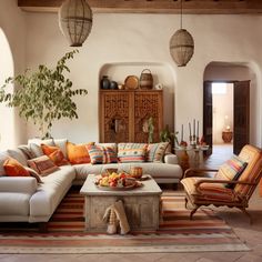 a living room filled with lots of furniture and pillows on top of a rug covered floor