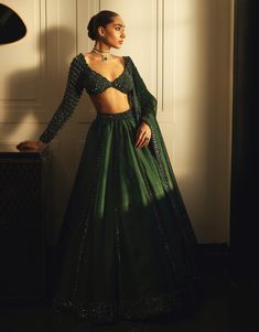 Exude sophistication in the dark jade green organza lehenga set showcasing an intricately hand-embroidered lehenga and dupatta adorned with sequins cutdana and crystal embroidery paired with a jewelled blouse featuring crystal accents. Green Organza Lehenga, Dark Jade Green, Tulle Lehenga, Ethereal Elegance, Lehenga Dupatta, Organza Lehenga, Crystal Embroidery, Green Lehenga, Vacuum Storage