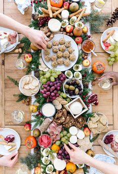 people sitting at a table with food on it