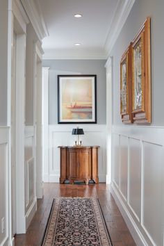 the hallway is clean and ready for us to use as an entrance way in this home