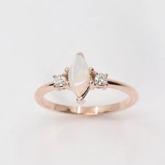 an opal and diamond three stone ring