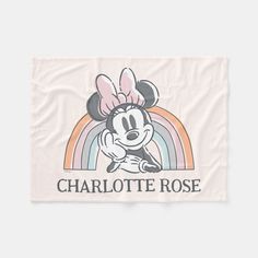 a towel with an image of minnie mouse and the word charlotte rose in front of it