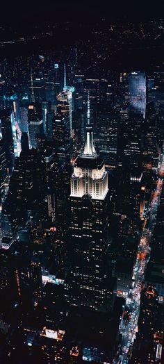 an aerial view of new york city at night from the top of the empire building