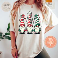 If you're looking for a thoughtful and practical gift, our apparel is sure to be appreciated by anyone who receives it. These Christmas gnomes tshirts are handmade to order on an ultra-soft shirt that will quickly become your go-to apparel item! Our trendy holiday tees are made with eco-friendly water-based ink that feels good and lasts longer! You will never want to take it off! ♥Sizing info♥ *Unisex sizing. *Order your true size for a more fitted feel. Size up for a slouchier look ♥Care Instructions♥ *Wash on cold *Hang dry or tumble dry on low heat *Non-chlorine bleach only *Do not iron directly on the design ♥Shipping♥ 🚚Every order (no matter how large) ships same or next business day! We want you to receive your garment as quickly as you can so you can start enjoying it! 📦Free shipp Ironic Tees, Holiday Tees, Bachelorette Tshirts, Winter Gifts, Christmas Gnomes, Funny Christmas Gifts, Comfort Colors Shirt, Funny Sweatshirts, Christian Clothing