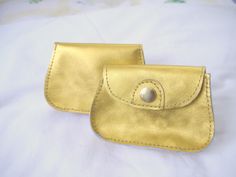 A gold purse to carry valuables!  It has enough room for cash, a few cards, and a lipstick.  There is a separate slot for the driver's license. The bright color may also be easier to find in a purse or pocket.  The gold finish on this item is vibrant and will get attention.   Dimensions are 4 ¾" X 3 ¼" and 1" deep. Thank you for viewing my items! Daily Use Gold Coin Purse With Card Slots, Gold Wallets With Card Slots For Daily Use, Gold Coin Purse With Coin Pocket As A Gift, Gold Coin Purse For Daily Use, Gold Rectangular Coin Purse For Daily Use, Gold Coin Purse As Gift, Gold Card Holder With Slots For Daily Use, Gold Card Holder With Card Slots For Everyday Use, Gold Card Holder With Interior Slots For Daily Use