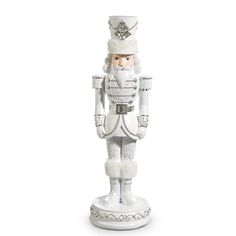 a white christmas nutcracker figurine on a white background