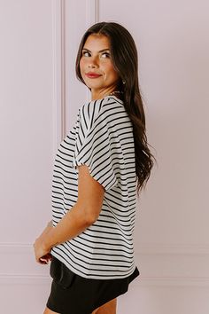 - Slay the day in stripes with this trendy top! - Unlined textured material with a striped pattern - A crew cut neckline - Short sleeves - A relaxed silhouette that ends in a straight hemline Chic Striped Crew Neck T-shirt, Summer Striped Tops With Ribbed Neckline, Striped Summer Tops With Ribbed Neckline, Chic Striped Top With Ribbed Neckline, Chic Striped Tops With Ribbed Neckline, Chic Striped T-shirt With Crew Neck, Chic Short Sleeve Tops With Striped Sleeves, Chic Short Sleeve Tops With Contrast Stripes, Chic White Tops With Striped Sleeves