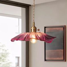 a light fixture hanging from the ceiling in a room