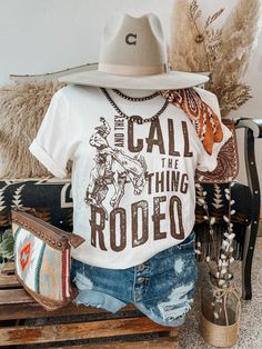 Garth Brooks said it best, they call the thing rodeo! Crew Neck | Unisex Fit | Short Sleeve Material: 100% Cotton Small (2/4) | Medium (6/8) | Large (10/12) | XL (14/16) | 2XL (18/20) Western Women Outfits, Rodeo Outfit Ideas, Dolly Parton Birthday, Bohemian Cowgirl, Country Style Outfits, Country Stuff, Rodeo Shirts, Rodeo Outfits, Garth Brooks