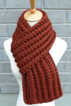 "This beautiful hand knitted scarf is made with Super Bulky and Soft Wool Blend Yarn (80% Acrylic, 20% Lambswool). Classic ribbed pattern, it looks the same on both sides. The scarf can be worn in multiple ways. Amazing color for the fall/winter season.  The color may appear slightly different on different monitors. Measures: 63\"- 65\" (160-165 cm) long x 7.5\" (19 cm) wide. More colors are here: https://www.etsy.com/ca/shop/TatianaKnits?section_id=42902267&ref=shopsection_leftnav_3 From a smok Hand Knitted Scarf, Bulky Knit, Hand Knit Scarf, Fall Scarves, Handmade Scarves, Super Bulky, Circle Scarf, Rust Orange, Crochet Scarves