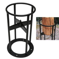 a black metal and glass side table with a tree stump in the back ground next to it