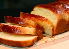 sliced loaf of bread sitting on top of a cutting board