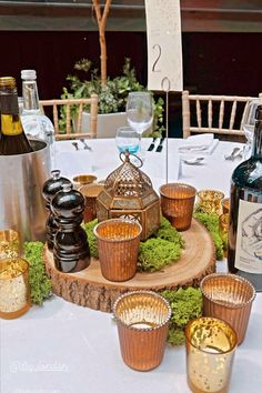 Indian themed wedding centrepieces with log slice, pretty brass lantern, copper and gold votive holders and moss. Hollywood Art Deco, Log Slice, Wedding Centrepieces, Wooden Log, Brass Lantern, Midsummer Nights Dream, Center Pieces, Food Themes, Event Styling