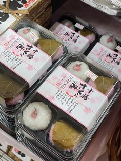 several packaged food items in plastic containers on display