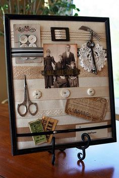 there is a picture frame with pictures and scissors on it