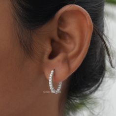 Round Cut Moissanite Huggies Earrings! Crafted with love and precision, these 14K Solid Gold Inside Out Hoop Earrings are perfect for any occasion. Whether it's an engagement gift for your wife. 𝐏𝐫𝐨𝐝𝐮𝐜𝐭 𝐕𝐢𝐝𝐞𝐨 𝐋𝐢𝐧𝐤: https://youtu.be/1bMOtJJgcws 𝐒𝐊𝐔: - GBJ1063 ✥ 𝐌𝐚𝐢𝐧 𝐒𝐭𝐨𝐧𝐞 𝐃𝐞𝐭𝐚𝐢𝐥𝐬 ↣ Shape: Round Cut ↣ Type: Moissanite ↣ Weight: 1.15 CTW (App.) ↣ Color/Clarity:  Colorless/VVS ↣ Making Process: Handmade - Crafted by our experienced team ✥ 𝐄𝐚𝐫𝐫𝐢𝐧𝐠𝐬 𝐃𝐞𝐭𝐚𝐢𝐥𝐬 ↣ Metal Purity: Solid Gold (10KT, 14KT, 18KT); Silver (925 Sterling, 935 Argentium), 950 Platinum ↣ Metal Tone: Yellow, White, Rose ↣ Stamp: Yes ✥ 𝐅𝐨𝐥𝐥𝐨𝐰 𝐔𝐬 Instagram:  @goldenbirdjewels  Facebook: @goldenbirdjewels Pinterest: @goldenbirdjewels Huggie Earrings With Halo Design In Cubic Zirconia, Classic Gia Certified Bridal Earrings, Gift Hoop Earrings With Halo Design And Round Cut, Hoop Earrings With Halo Design For Gift, Halo Design Hoop Earrings Gift, Gift Hoop Earrings With Halo Design, Gia Certified Sterling Silver Earrings, Moissanite Halo Design Earrings, Diamond White Halo Design Small Hoop Earrings