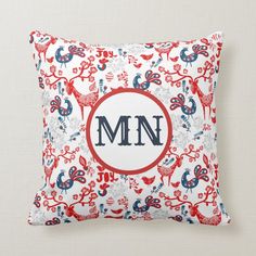 a red, white and blue monogrammed pillow with the letter mn on it