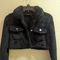 This Black Fuzzy Jacket Is Size Extra Small. Two To Four Sleeves Are 21 Inches Long. The Jacket Is 12 In Long Crop Style 16 In Wide 100% Polyester. Size Runs A Little Big See My Measurements . New With Tags Never Worn. Non-Smoker And Clean! Long Plaid Coat, Red Puffer Coat, Cheetah Print Jacket, Army Green Coat, Green Denim Jacket, Cropped Zip Up, Checkered Jacket, Embroidered Coat, Flannel Jacket