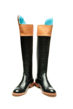 Milenika's handmade black women's tall riding boots, equestrian-inspired boots. These boots feature soft black leather, high Spanish-cut topline, almond toe, detailed with turquoise blue the pull up stripe, brown panel and handcrafted leather sole and zip fastening along back for easy to put on/off. We like them styled with skinny jeans, sleek leggings or an oversized sweater dress. Full leather outer, interior and sole. DETAILS: Full leather upper, lining and sole Black and brown leather Turquo Black Knee-high Riding Boots For Fall, Fitted Black Knee-high Riding Boots, Black Wide Calf Knee-high Boots For Riding, Black Knee-high Moto Boots For Riding, Black Knee-high Moto Riding Boots, Black Knee-high Boots With Round Toe For Riding, Black Flat Boots, Sweater Dress Oversized, Boots Knee High