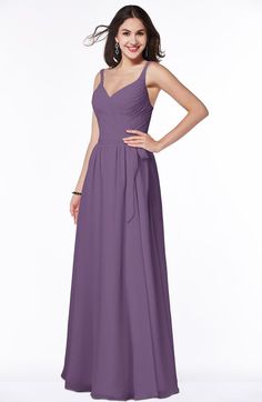 a woman wearing a long purple bridesmaid dress