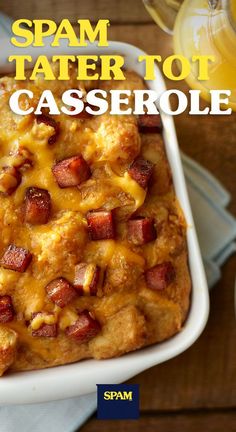 spam tater tot casserole in a white dish on a wooden table