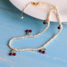 Free shipping worldwide! Evocative of southern Italy's summer days and beautifully crafted, this cherry necklace is dipped in 18K gold and crafted with natural pearls. Featuring hand-painted red dainty cherries, this adorable necklace is feminine and very delicate. Elegant Necklaces, Freshwater Pearl Necklaces, Pearl Size