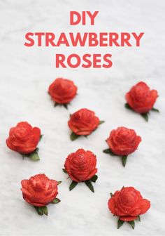 there are many red roses on the white surface with text that reads diy strawberry roses