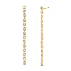 These Illusion Diamond Dangle Earrings feature a row of sparkling round diamonds set in a classic gold bezel setting. The diamonds are evenly spaced along a sleek, linear design, creating a sophisticated and elongated silhouette. Classic Linear Earrings With Diamond Accents, Classic Long Drop Linear Earrings With Diamond Accents, Diamonds Direct, Round Diamond Setting, Linear Design, Diamond Dangle Earrings, Classic Gold, Bezel Setting, Round Diamonds