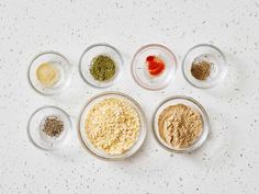 six bowls with different types of spices in them