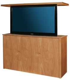 a flat screen tv sitting on top of a wooden cabinet