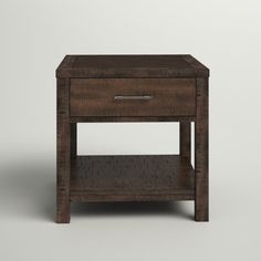 a small wooden table with one drawer open