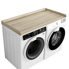 a white washer sitting next to a wooden counter