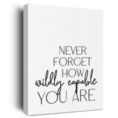 a white canvas with black lettering on it that says never forget how wildly capable you are