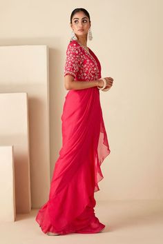 Pink padded wrap blouse with all over floral pattern, contrast cut dana, zari, sequin and bead hand embroidery. Paired with pre-draped ruffle saree with pleated cowl draped attached pallu and ruffle border. - Aza Fashions Western Gown, Set Saree, Ruffle Saree, Saree For Women, Drape Saree, Sharara Set, Pink Ruffle, Traditional Sarees, Pink Saree