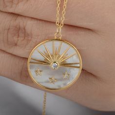 "Description Natural 2.35 Ct. Mother Of Pearl Gemstone Diamond Sun & Star Design Disc Pendant Necklace Solid 18K Yellow Gold Handmade Fine Jewelry Gift ≫ Features * Items Code: SBP0024 * Metal: 18K Solid Gold (14K also available - Additional fees may apply) * Solid 14K Yellow Gold with stamped * More options in gold color: Rose gold, yellow gold, White gold * Mother Of Pearl Weight:- 2.35 Ct. * Diamond Wt. :- 0.05 Ct * Diamond Color - G-H * Diamond Clarity - SI * Diamond Cut - Brilliant * Pendan White Diamond Celestial Jewelry, Celestial Cubic Zirconia Round Necklace, Celestial White Diamond Jewelry, White Celestial Diamond Jewelry, Diamond White Round Celestial Necklace, Diamond White Celestial Round Necklace, Celestial Diamond Necklace With Polished Finish, White Cubic Zirconia Celestial Jewelry, Celestial White Jewelry With Birthstone