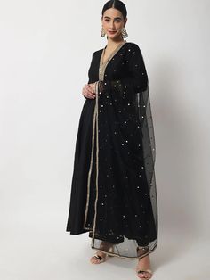 This is a beautiful 3-piece suit set. It comes with solid anarkali kurta has 3/4th sleeves, round neck, calf length teamed with solid churidar pants and a net dupatta. 3-piece set Color- Black Work- Solid with lace work Kurti Length - 46 inch Kurta Fabric-Silk Bottom Fabric - Silk Dupatta Fabric - Net dupatta Sleeves-3/4th Sleeves Neck-V Neck Care - Dry Clean Black Anarkali Suits, Shiny Heels, Velvet Kurti, Black Anarkali, Desi Vibes, Designer Anarkali Suits, Churidar Designs, Royal Aesthetic, Designer Anarkali