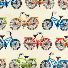 colorful bicycles on white fabric with black spokes and orange, yellow, green, blue, red, pink, purple, or turquoise