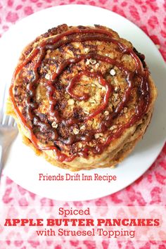 a stack of pancakes on top of a white plate