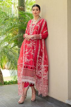 Description: The red embroidered lawn shirt comes with detailed embroidery on the front and sleeves. A matching cotton trouser and embroidered matching organza dupatta finish off the look. Materials: Shirt (Lawn) - Embroidered Front and Sleeves Dupatta (Organza) - Embroidered Organza Dupatta Trouser (Cotton) - Plain Trouser *Disclaimer: Due to the many variations in monitors and browsers, the color of products may appear different on different monitors. **Additional decorative trim has been added to the outfit in the photos. The stitched outfit will not include the additional designer trim. Red Designer Lawn Suit With Sheer Dupatta, Anarkali Lawn Suit With Sheer Dupatta In Red, Red Anarkali Lawn Suit With Sheer Dupatta, Red Lawn Suit With Sheer Dupatta For Diwali, Red Unstitched Organza Suit For Designer Wear, Red Organza Unstitched Suit For Designer Wear, Red Lawn Suit With Sheer Dupatta For Eid, Eid Red Organza Lawn Suit, Semi-stitched Red Lawn Suit With Sheer Dupatta