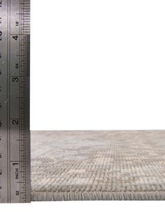 a close up view of a ruler and carpet