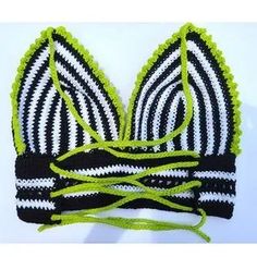 a black and white striped bra with green string