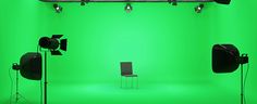 green screen studio with chairs and lights in front of the camera set up for an image