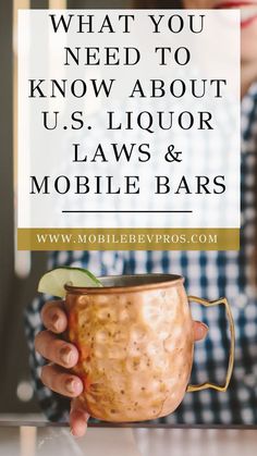 a person holding a mug with the words what you need to know about u s liquor laws and mobile bars