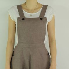 "Handmade coffee dress sleeveless and 2 pockets , perfect for casual wear and suitable for any occasion in any season Details: - 100% natural linen produced in Europe ; - medium weight (180 gram per square meter); - color: coffee, could be any from our colors catalog (color samples at the photo); Made to order, approximately a few days, If you have any questions please message me and I will be glad to answer. Size guide : Size XS Bust: fits bust around 33\"-34\"/ 84-88 cm Waist: fits waist aroun Summer Linen Pinafore Dress, Sleeveless Cotton Suspender Dress With Pockets, Casual Dresses With Adjustable Straps For Work, Casual Work Dresses With Adjustable Straps, Casual Workwear Dress With Adjustable Straps, Sleeveless Linen Pinafore Dress, Sleeveless Linen Dress With Pockets For Work, Casual Sleeveless Pinafore Dress With Pockets, Brown Linen Dresses With Pockets