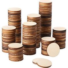 a stack of wooden discs on a white background