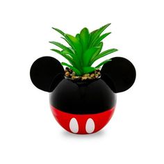 a mickey mouse planter with a pineapple in it's head on a white background