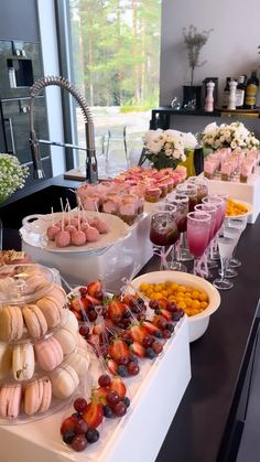 an assortment of snacks and drinks on a buffet table